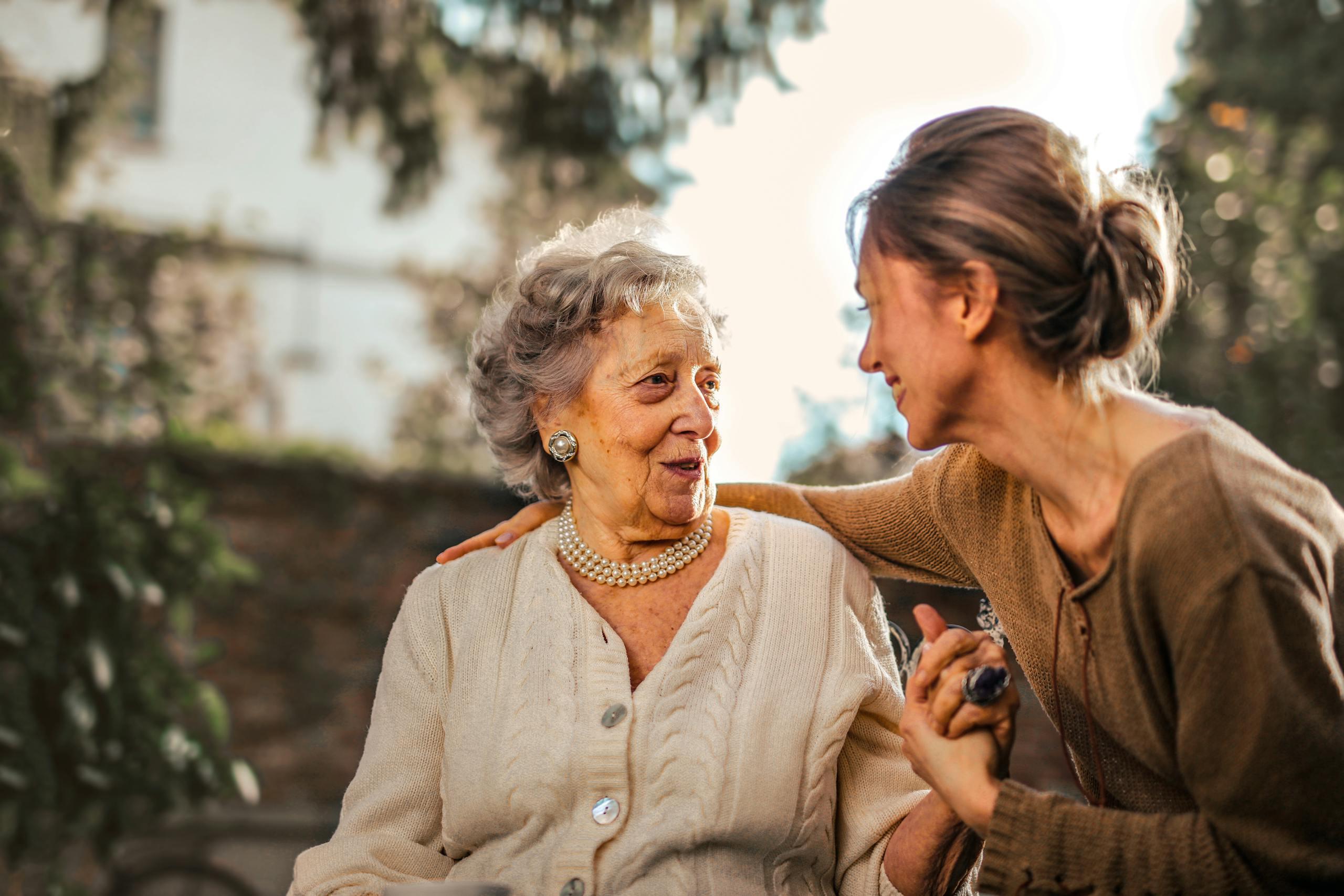 An occupational therapist supporting a client outdoors